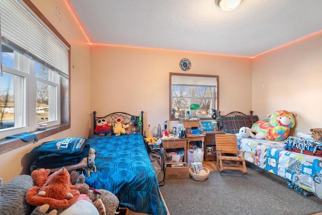 carpeted bedroom featuring ornamental molding