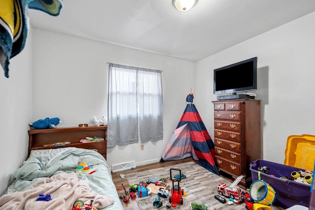 bedroom with hardwood / wood-style floors