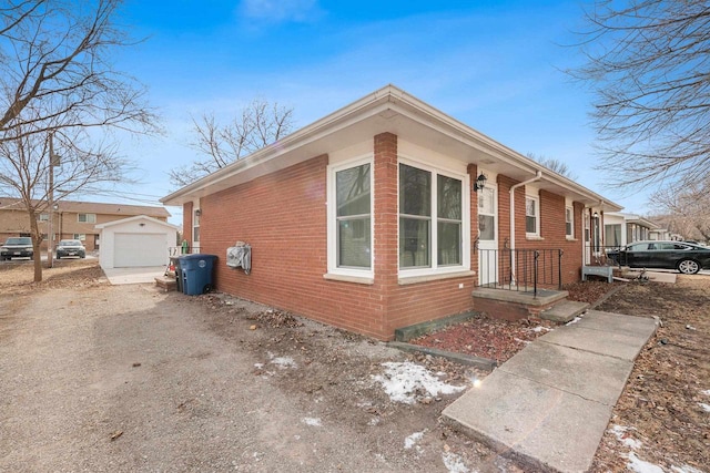 view of home's exterior featuring an outbuilding and a garage