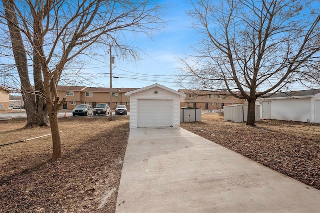 view of front of home with a garage and an outdoor structure