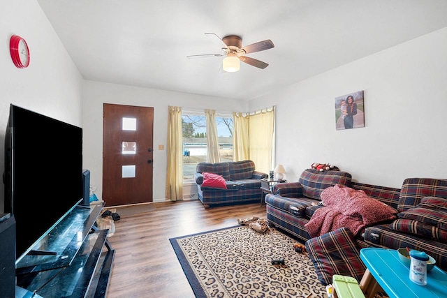 living room featuring ceiling fan and wood-type flooring