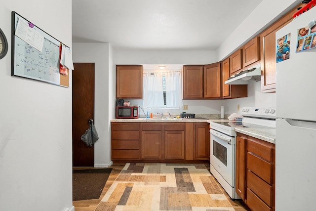 kitchen featuring sink and white appliances