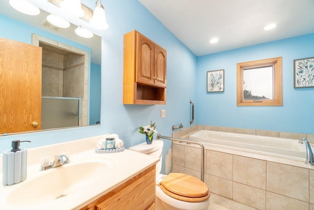 full bathroom with vanity, shower with separate bathtub, and toilet