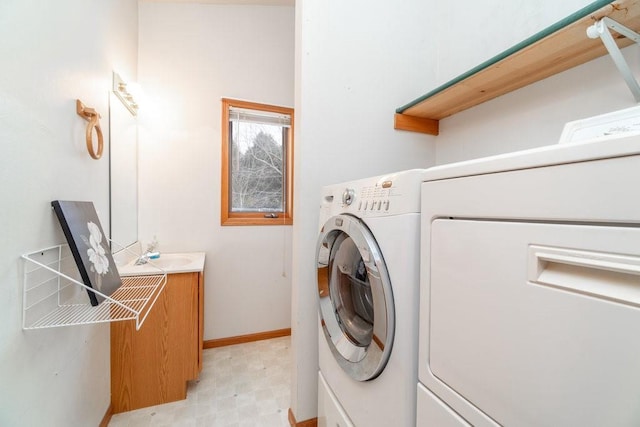 washroom featuring washing machine and dryer