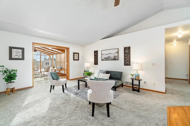 living room featuring lofted ceiling and light carpet