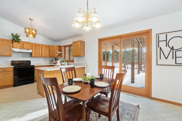 dining room featuring lofted ceiling, an inviting chandelier, and french doors