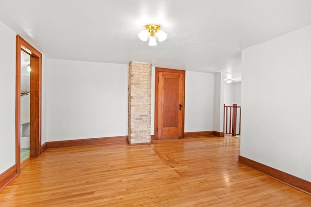 empty room with light hardwood / wood-style floors