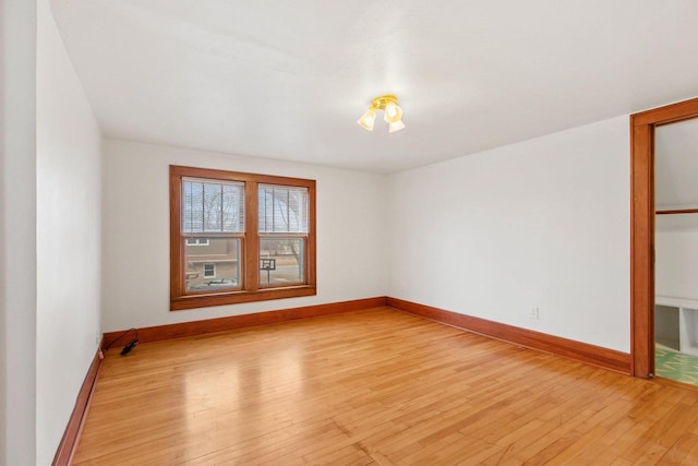 spare room with light hardwood / wood-style floors