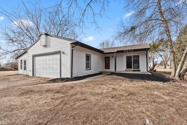 ranch-style home featuring a garage