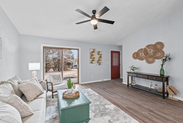 living room with ceiling fan and hardwood / wood-style floors