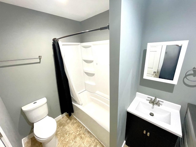 full bathroom with vanity, shower / tub combo, and toilet