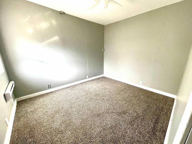 unfurnished room featuring ceiling fan and carpet flooring