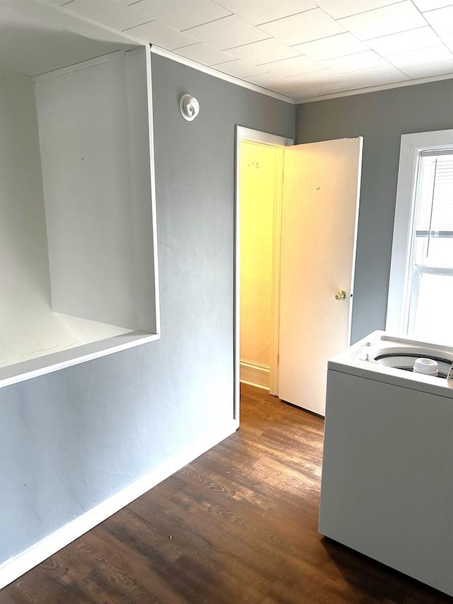 interior space featuring dark hardwood / wood-style flooring and washer / clothes dryer