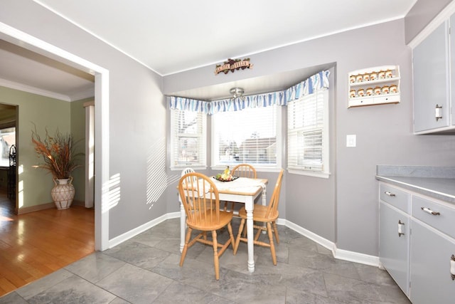 dining space featuring ornamental molding