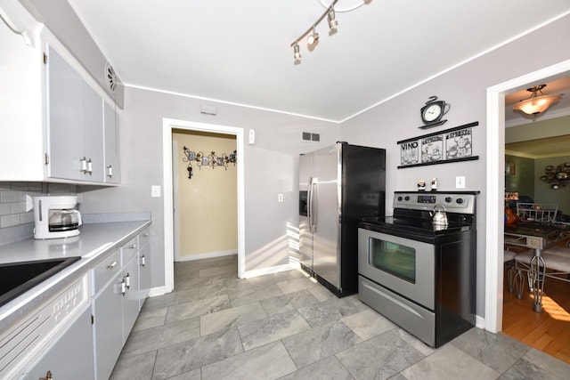 kitchen with white cabinetry and appliances with stainless steel finishes