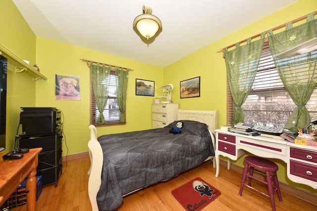 bedroom with light wood-type flooring