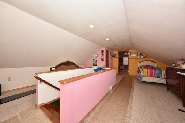 bedroom with lofted ceiling and light carpet