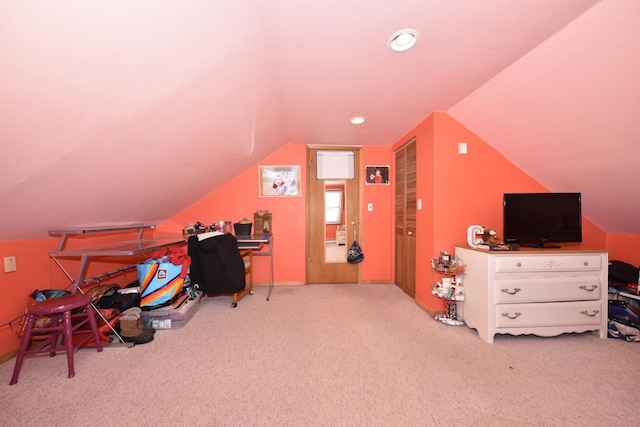 office featuring lofted ceiling and light colored carpet