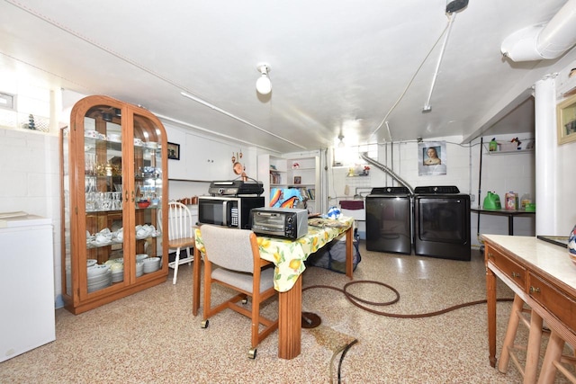 dining room featuring independent washer and dryer