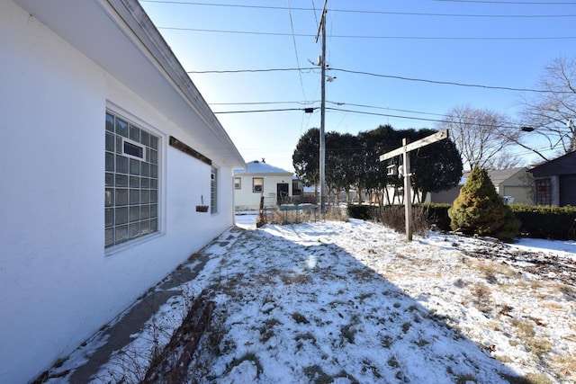 view of yard covered in snow