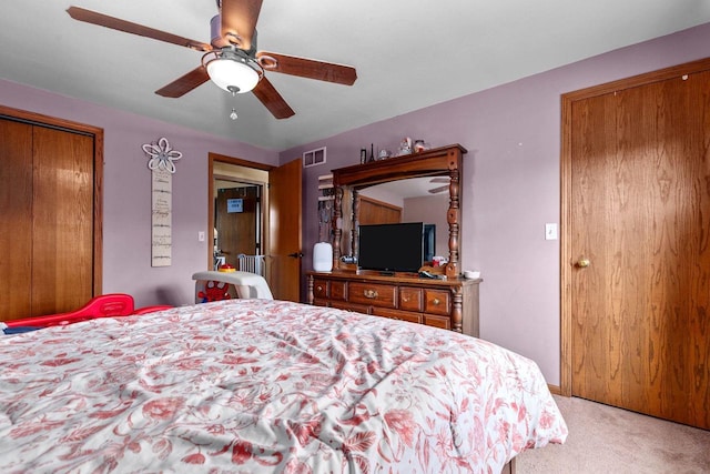 carpeted bedroom with ceiling fan