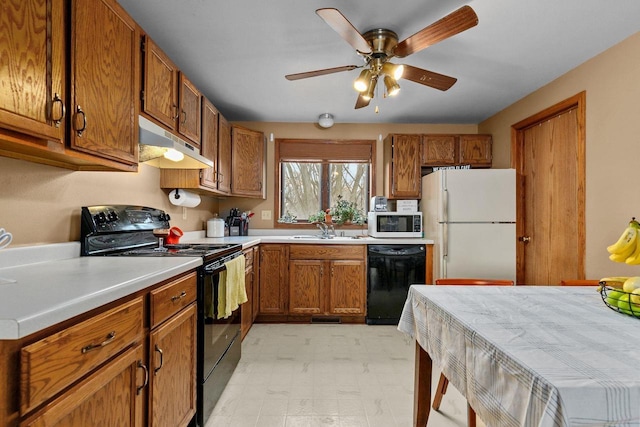 kitchen with ceiling fan, sink, and black appliances