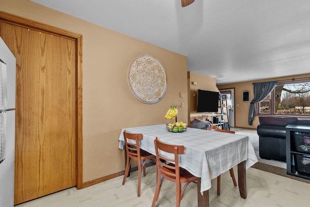 dining space with carpet flooring