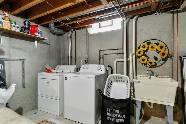 laundry area with washer and clothes dryer and sink