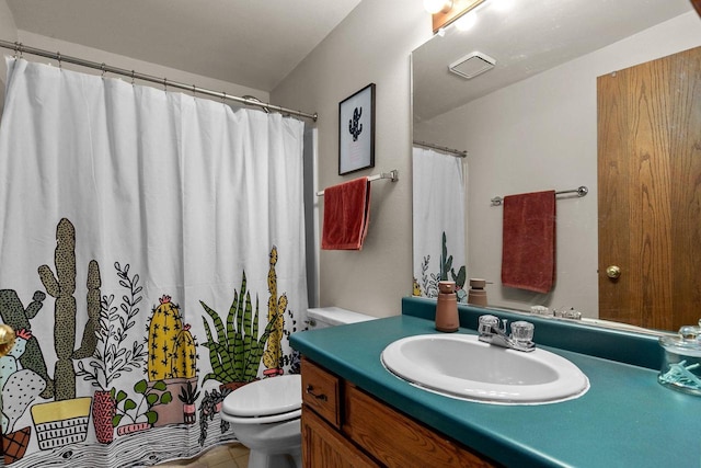 bathroom with tile patterned floors, vanity, and toilet