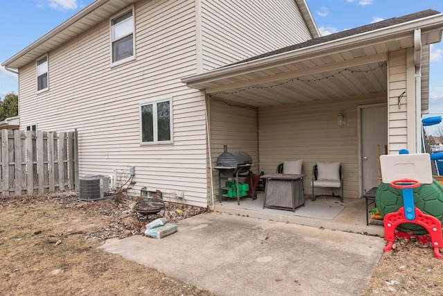 back of house with central AC and a patio