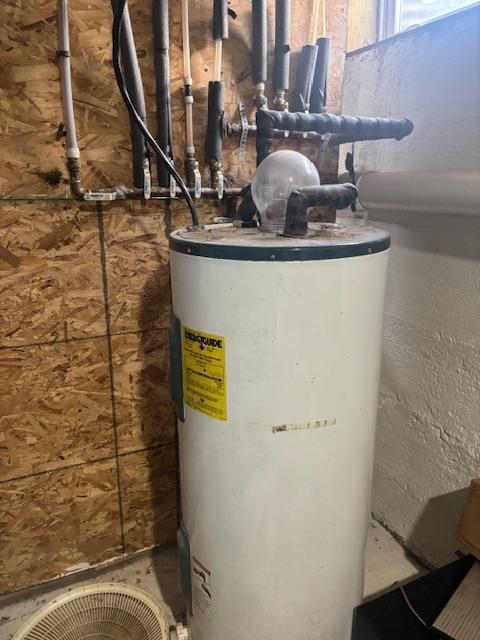 utility room with water heater