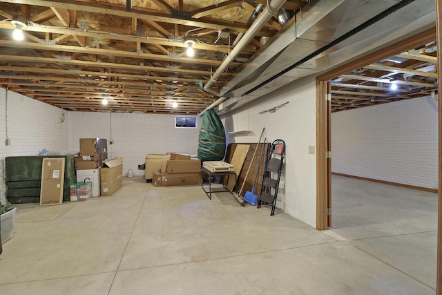 basement with brick wall