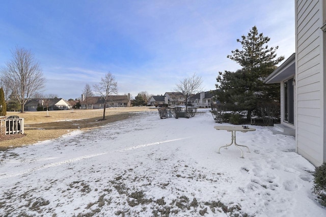 view of yard layered in snow