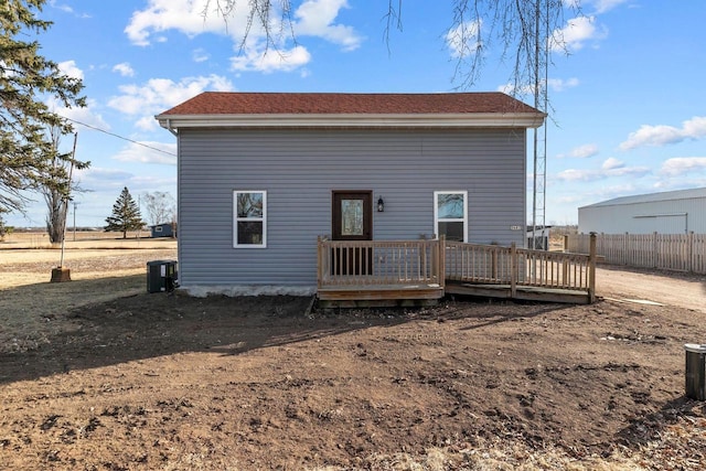 back of house with a wooden deck and central air condition unit