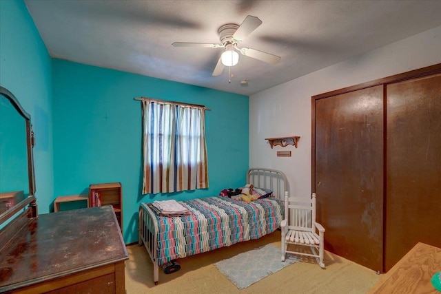 carpeted bedroom with ceiling fan