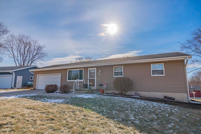 single story home featuring a garage and a front yard