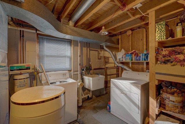 basement featuring sink and washing machine and clothes dryer