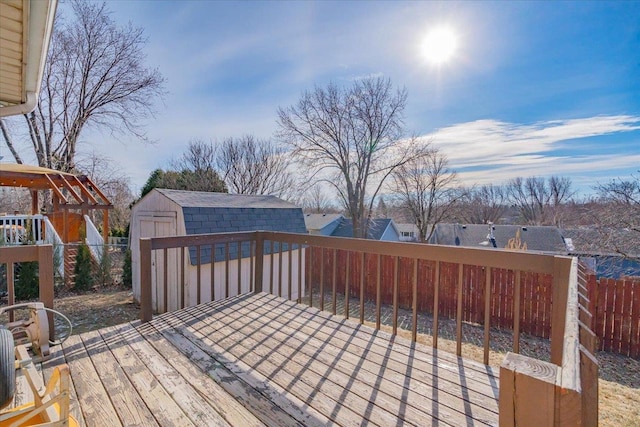 wooden terrace with a storage shed