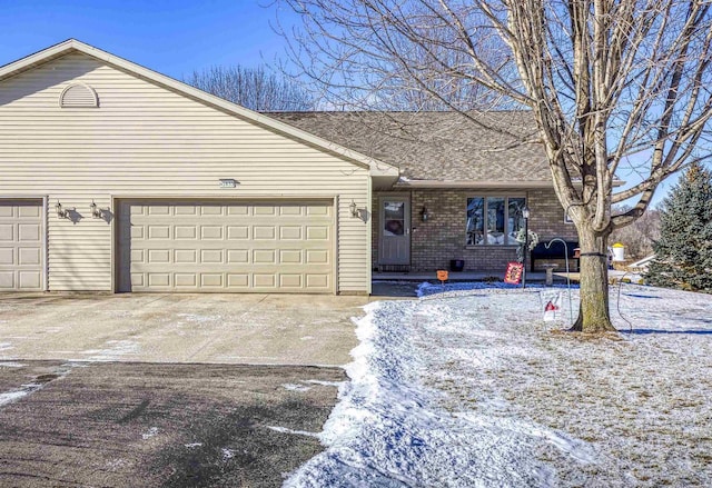 ranch-style house featuring a garage