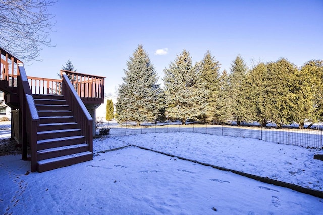 view of yard layered in snow