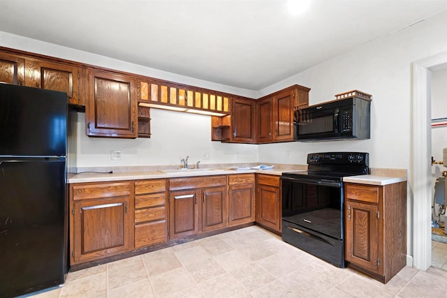 kitchen with sink and black appliances