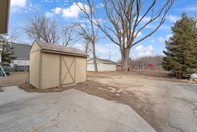 view of yard featuring a shed and a playground