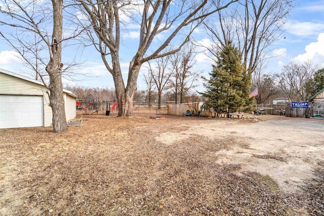 view of yard featuring a garage