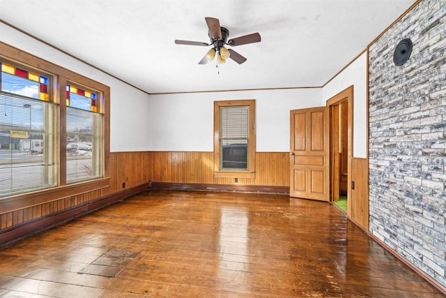 unfurnished room featuring crown molding, ceiling fan, and dark hardwood / wood-style flooring