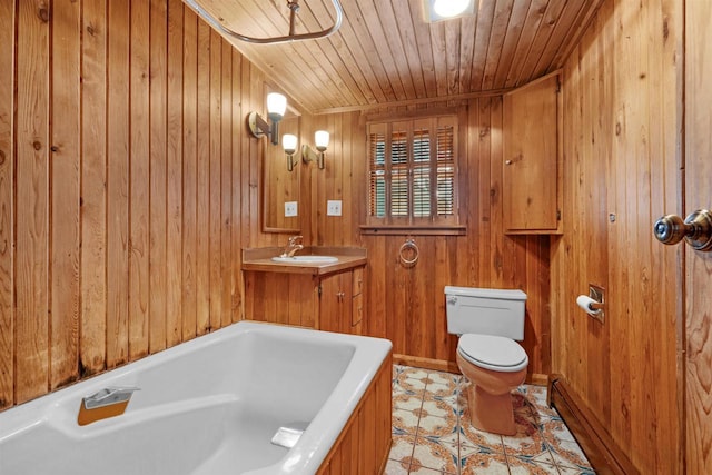 bathroom with sink, wood ceiling, a tub, toilet, and wood walls