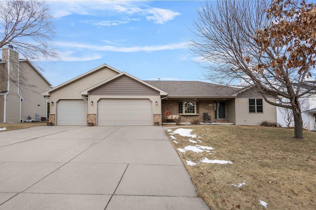 ranch-style house with a garage and a front lawn