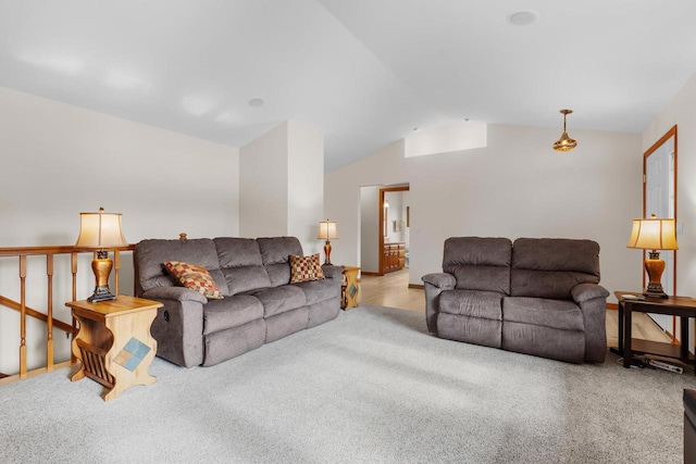 living room with lofted ceiling and light colored carpet