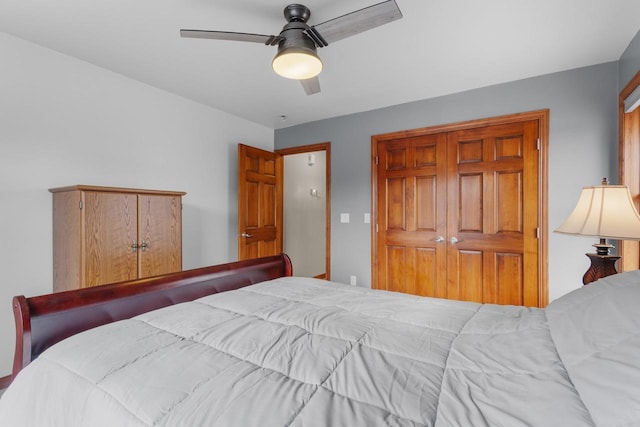 bedroom featuring ceiling fan and a closet