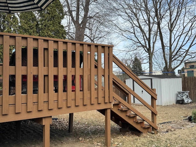 wooden deck with a storage shed