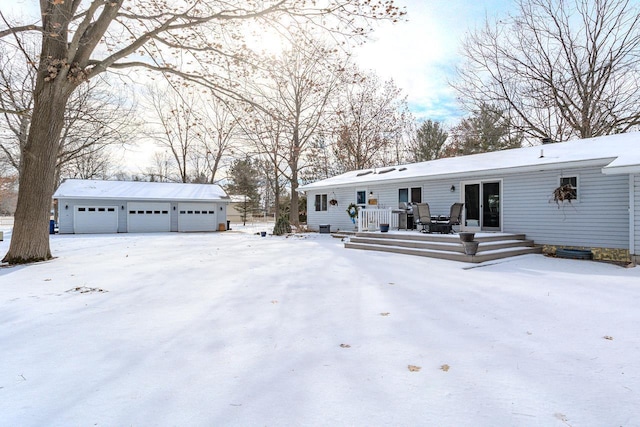 exterior space with an outbuilding and a garage